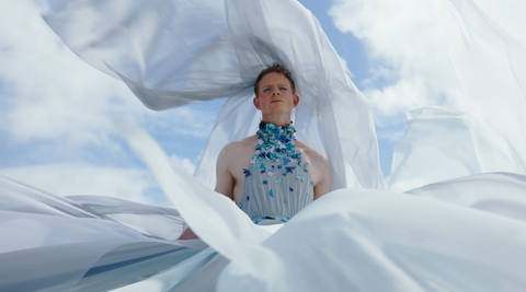 Pattie is windswept in pale blue fabric